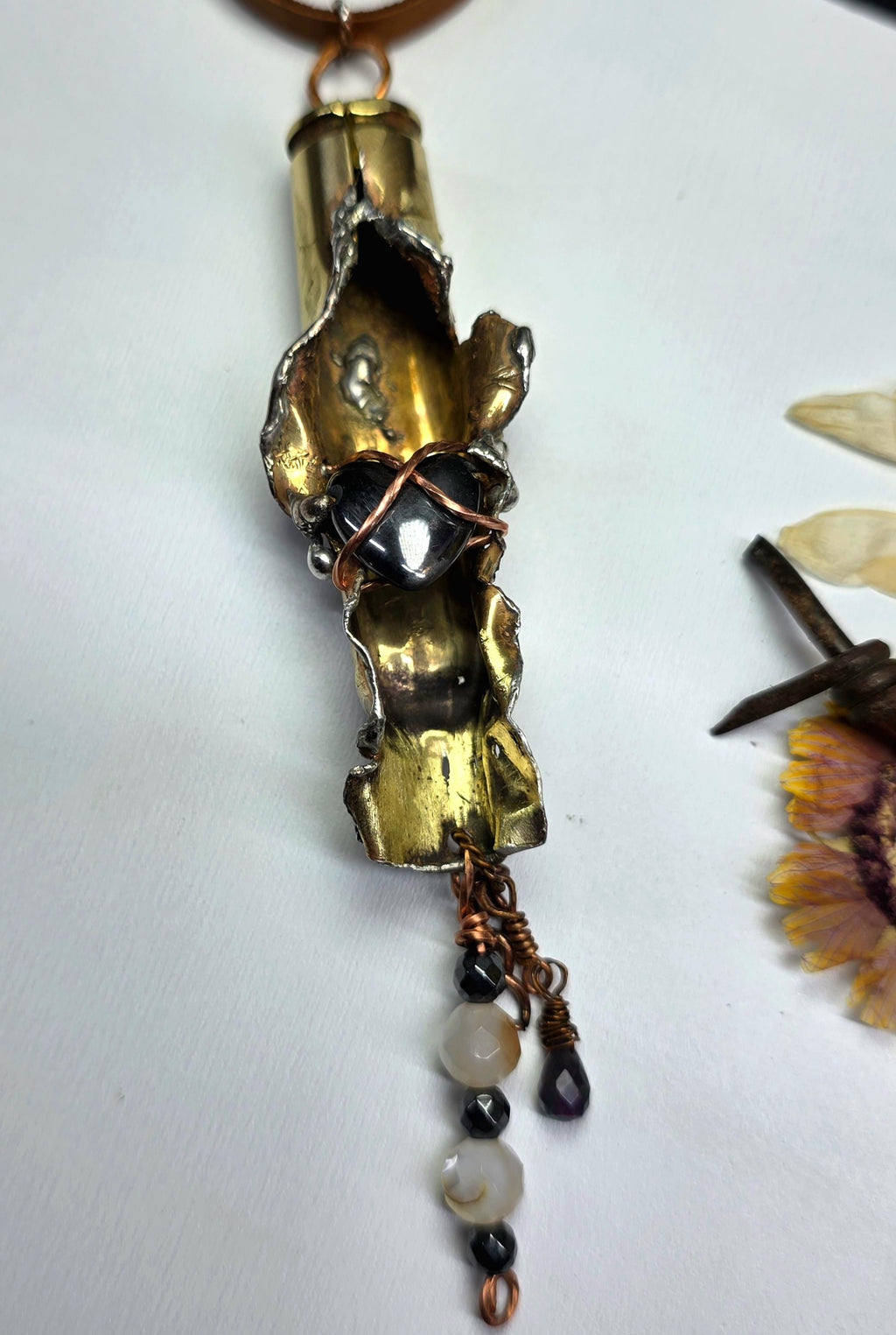 UNBROKEN “Center Mass” Shell Casing Pendant – Hematite Heart Necklace, Raw Metal Talisman, Survivor Jewelry, Rugged Artisan Pendant