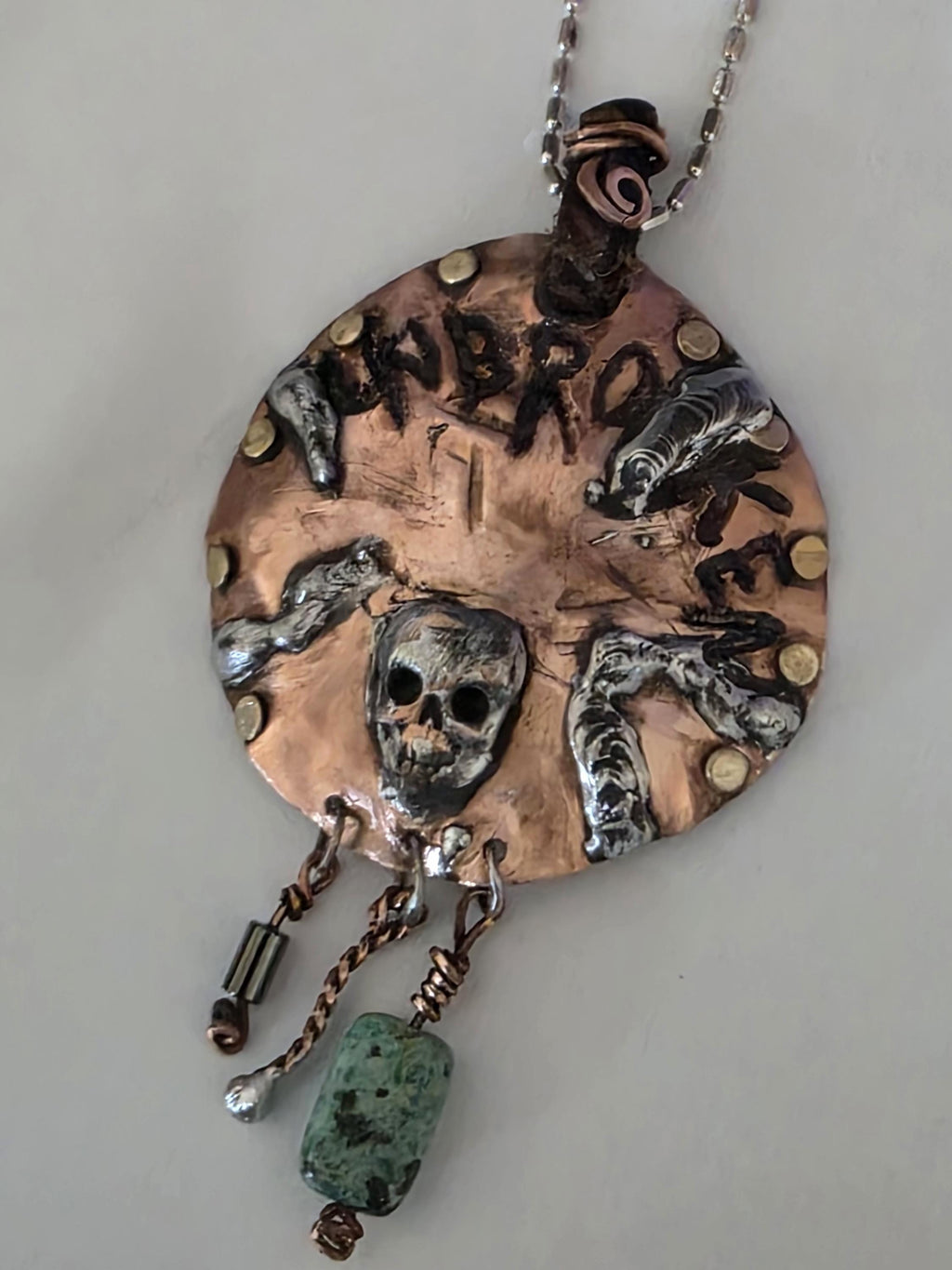 UNBROKEN Skeletons at Our Door Necklace | Handmade Copper Shield Pendant | Skull and Turquoise Survivor Jewelry