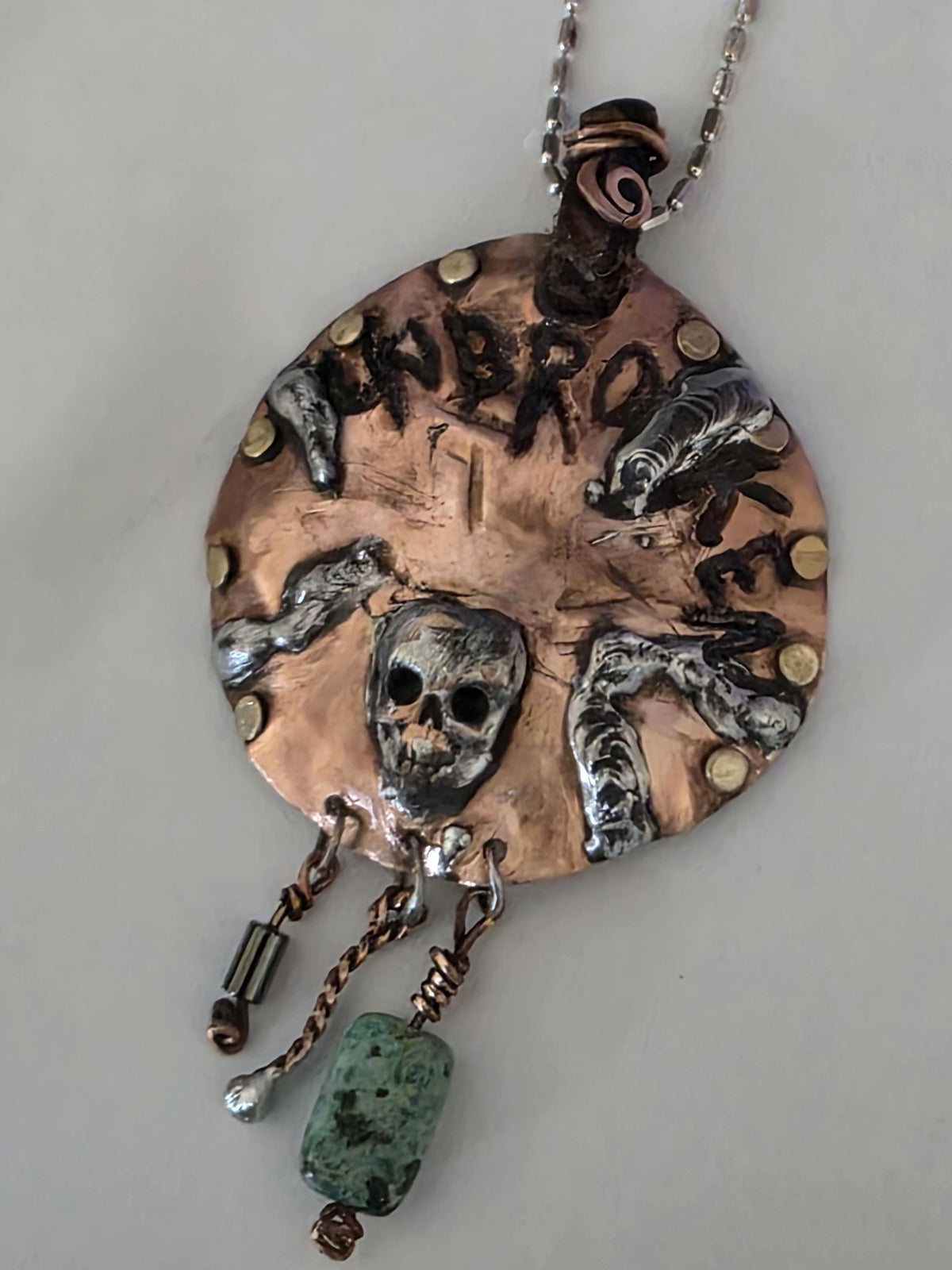 UNBROKEN Skeletons at Our Door Necklace | Handmade Copper Shield Pendant | Skull and Turquoise Survivor Jewelry